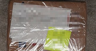 Aseguran kilo y medio de drogas en empresa de paquetería en Puebla