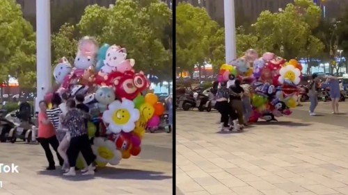 Vendedora de globos casi es levantada por fuertes vientos; la ayudan pero termina mal (Vídeo)