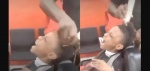 Foto: Cortesía Padre y menor en una barbería durante un corte de cabello.